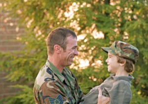 Army vet smiling with his son 