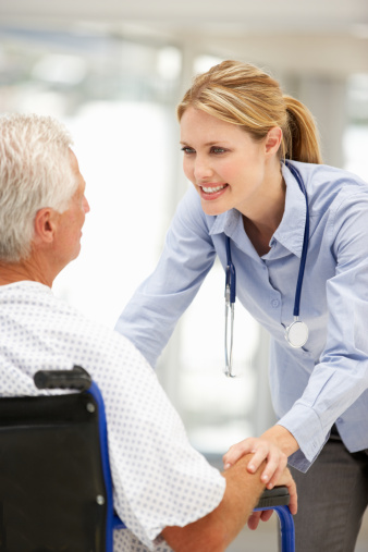 Senior patient talking with young doctor