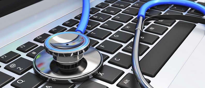 Stethoscope laying on a laptop keyboard